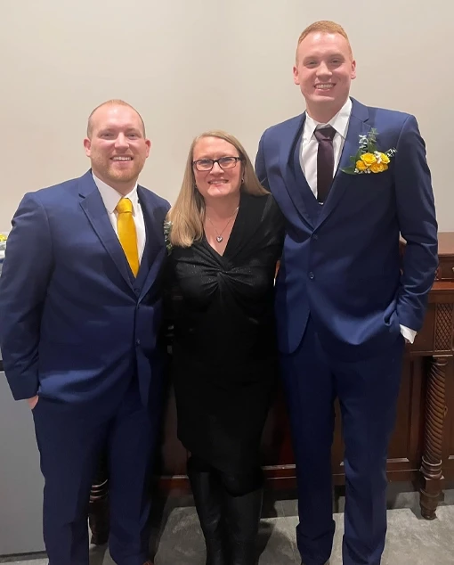 Two grooms with their officiant after their ceremony in Indiana